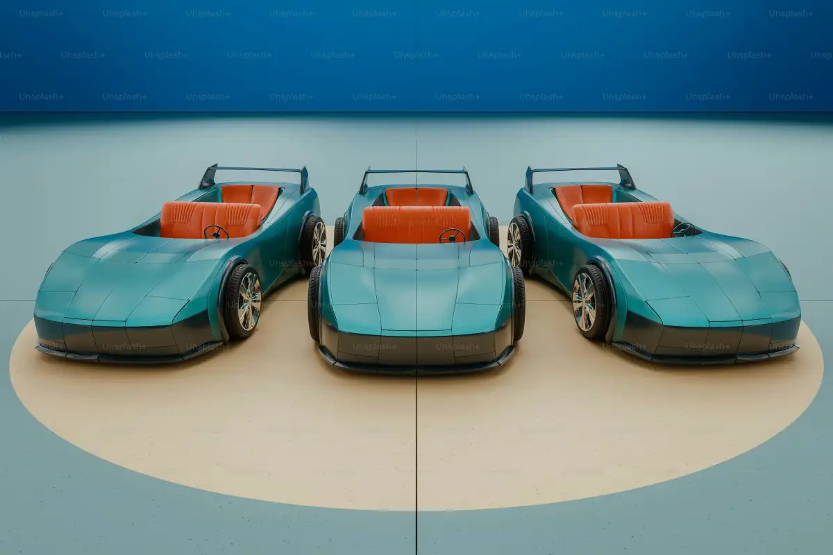 A group of three toy cars sitting on top of a table
